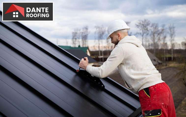 Person cleaning a roof with during spring maintenance